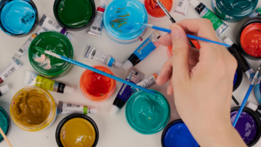 Artist painting a custom pet portrait by hand with watercolor-style paints